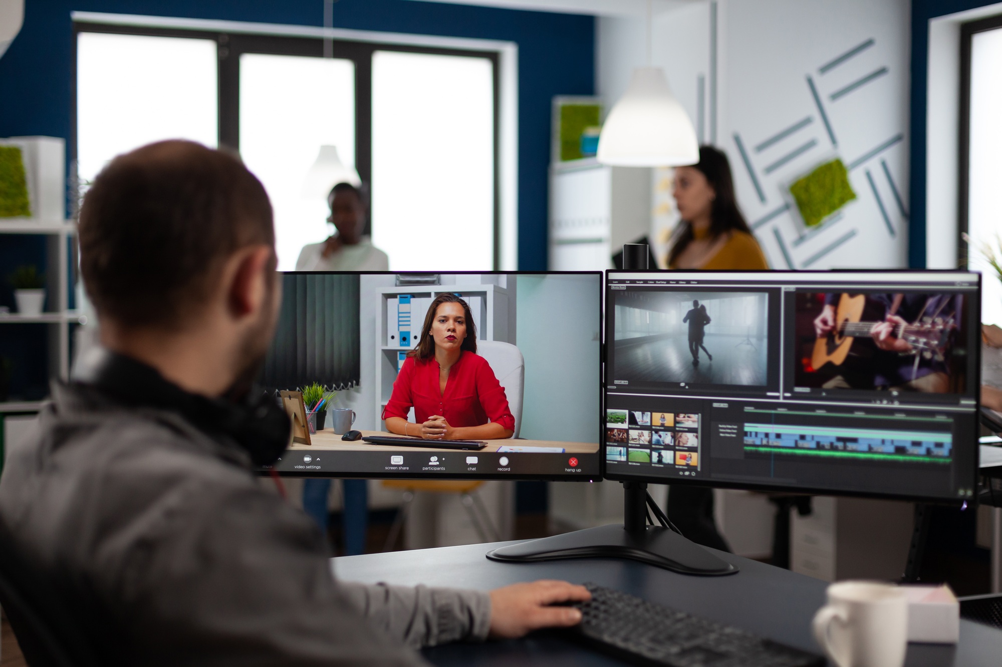 Video editor in web online production conference with project manager on video call